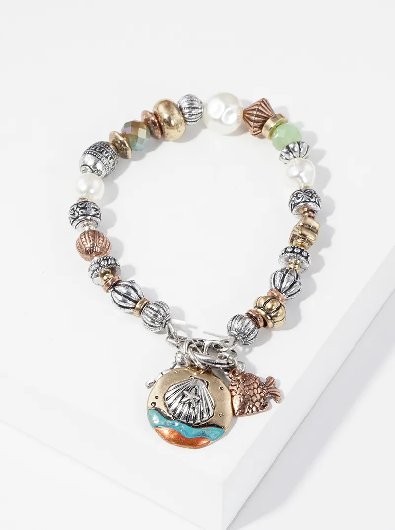Artisan sea life themed charms metal toggle closure stretch bracelet